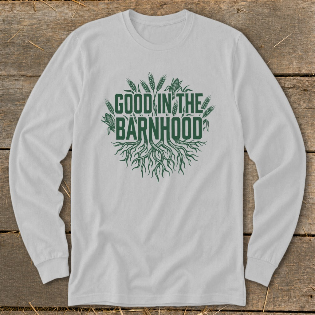White long sleeve shirt with green text "GOOD IN THE BARNHOOD" and roots graphic.