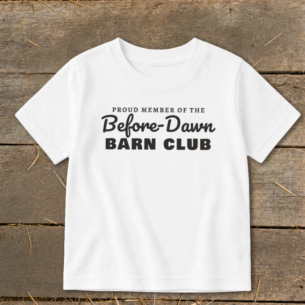 White t-shirt with black text reading "Proud Member of the Before-Dawn Barn Club".