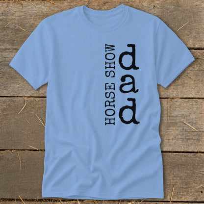 Light blue t-shirt with vertical text "HORSE SHOW DAD" in black.
