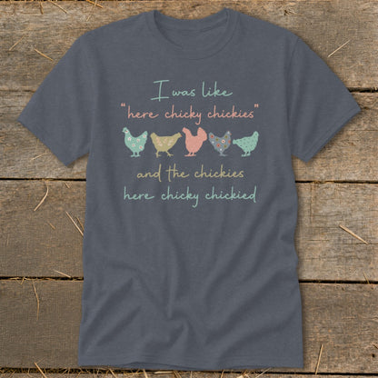 Dark grey t-shirt with pastel chickens and text "I was like 'here chicky chickies'".