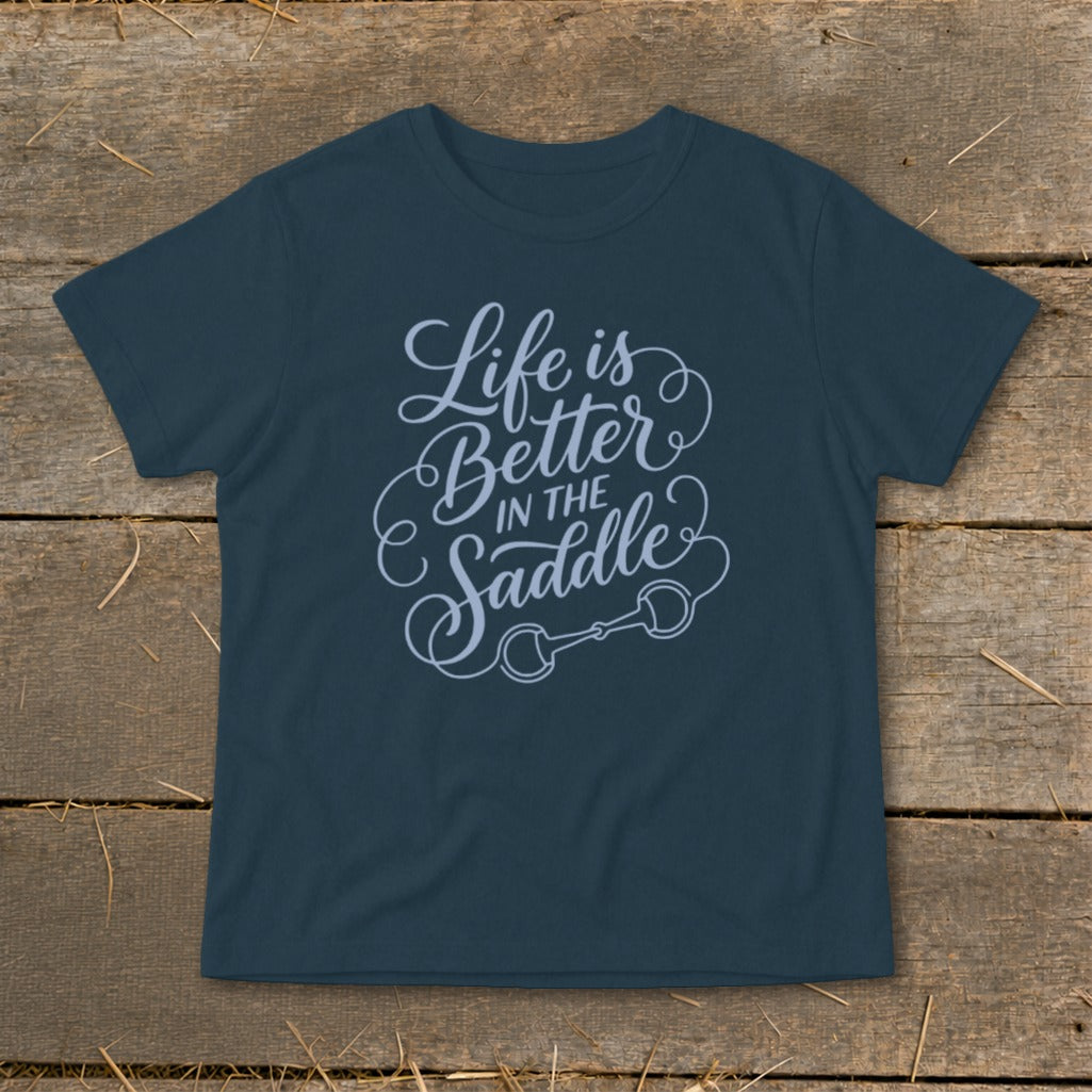 Navy t-shirt with "Life is Better IN THE Saddle" text and a horse bit graphic.