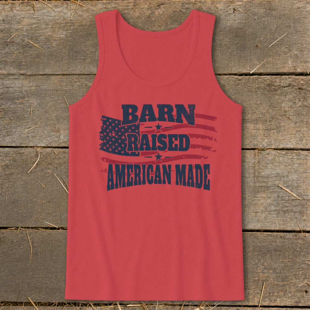 Red tank top with navy blue text "BARN RAISED AMERICAN MADE" and flag graphic.