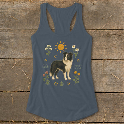 Blue tank top with a watercolor-style border collie surrounded by flowers and a sun.