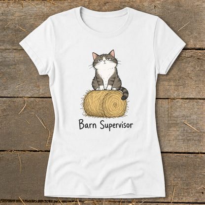 White t-shirt with cartoon cat sitting on hay bale, text "Barn Supervisor".