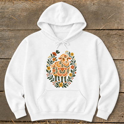 White hoodie with a central folk art sheep design surrounded by flowers.