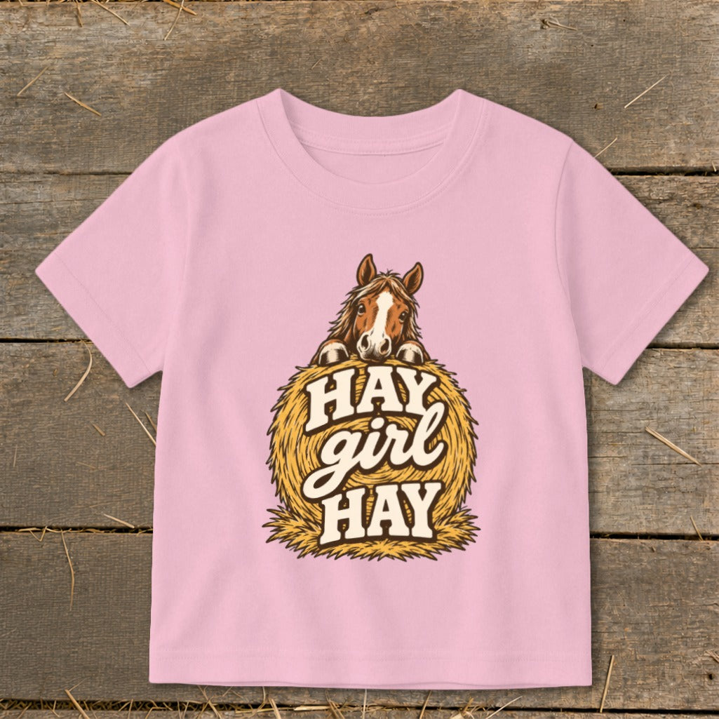 Pink t-shirt with horse and "Hay girl hay" text graphic.