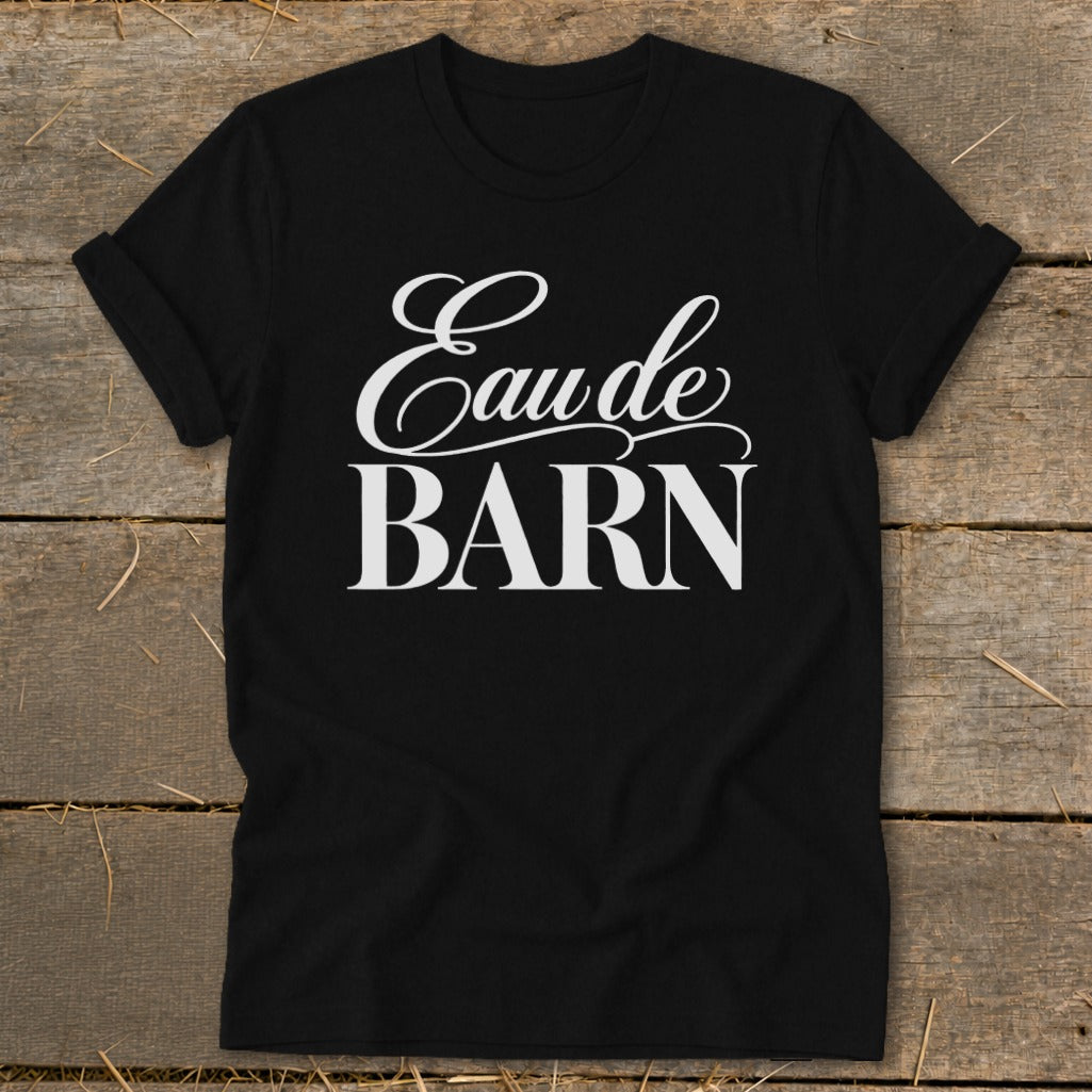Black t-shirt with white text "Eau de BARN" in decorative font.