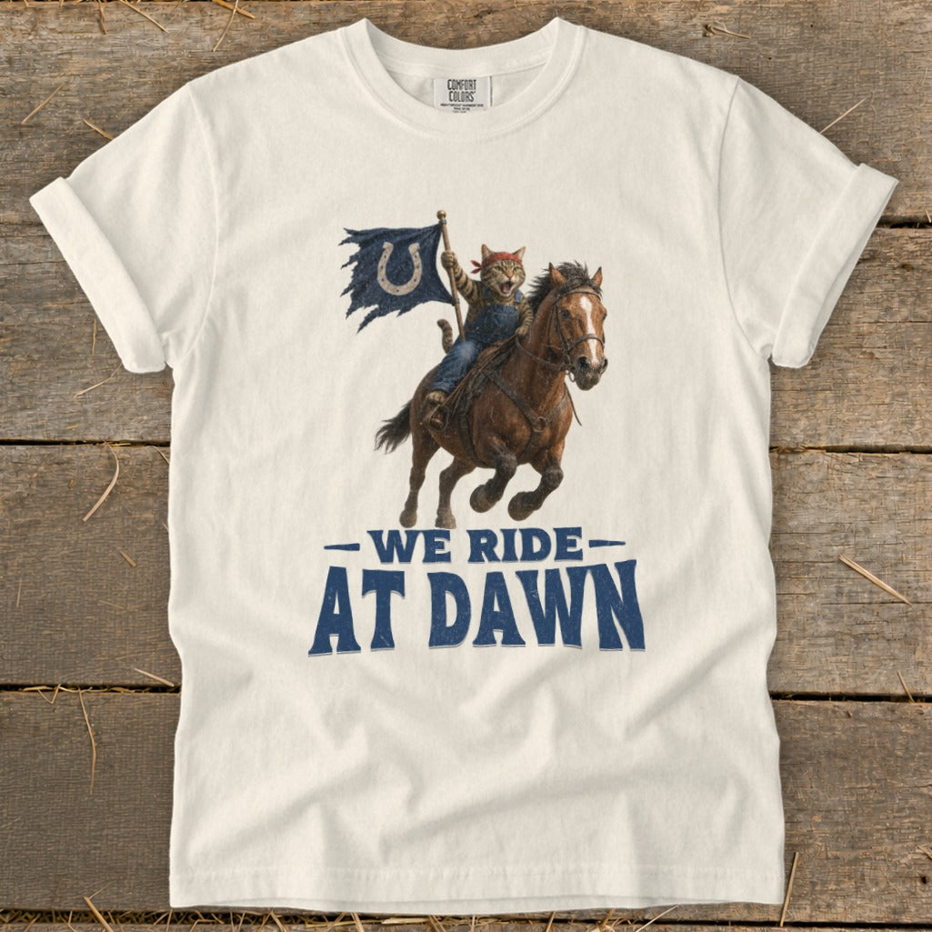 Cat riding horse with Colts flag, text says "We Ride At Dawn".
