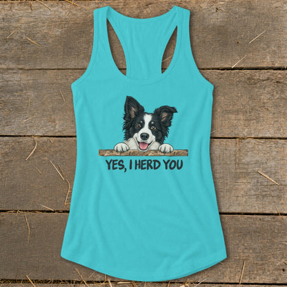 Turquoise tank top with a happy Border Collie peeking over a wooden bar, text reads "YES, I HERD YOU."