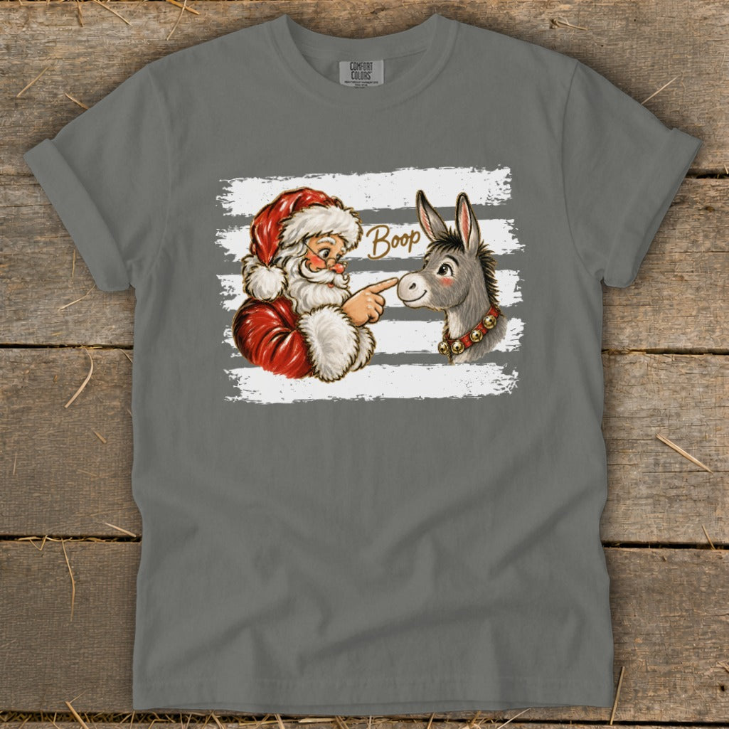 Santa touching a donkey's nose with the word "Boop" above.