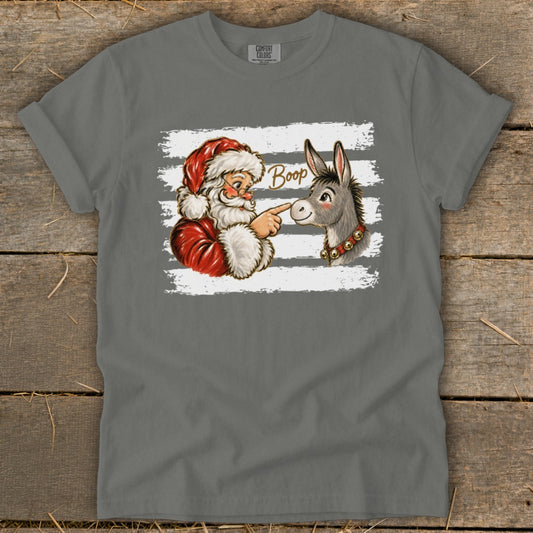 Santa touching a donkey's nose with the word "Boop" above.
