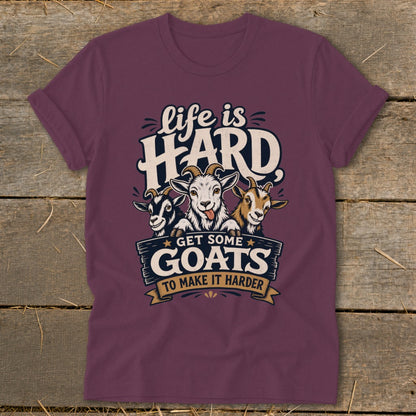 Maroon t-shirt with cartoon goats and text "life is HARD GET SOME GOATS TO MAKE IT HARDER".