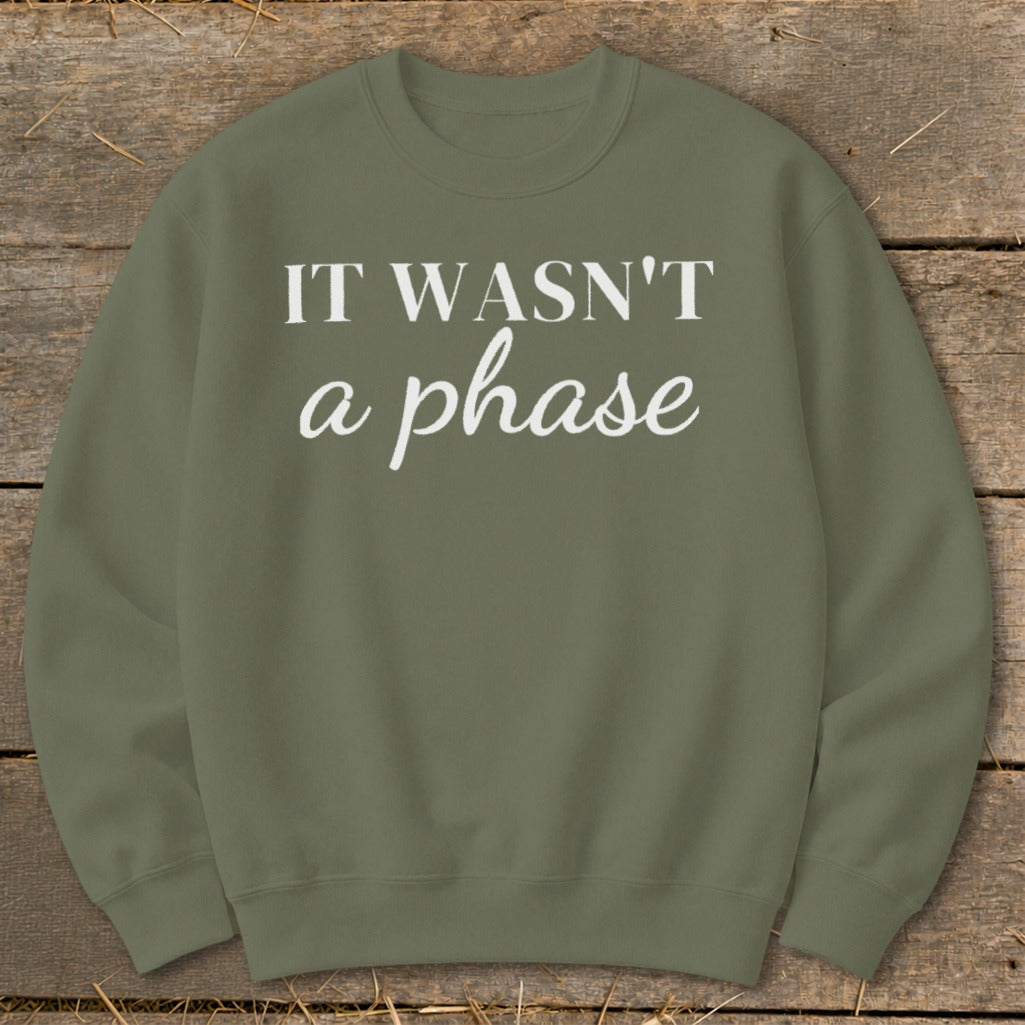 Olive green sweatshirt with white text "IT WASN'T a phase"