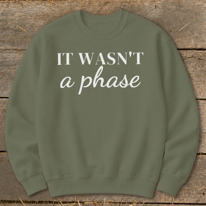 Olive green sweatshirt with white text "IT WASN'T a phase"