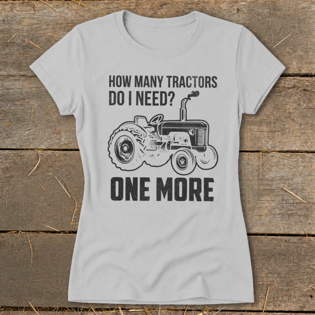 Light grey t-shirt with a tractor graphic and text "HOW MANY TRACTORS DO I NEED? ONE MORE".