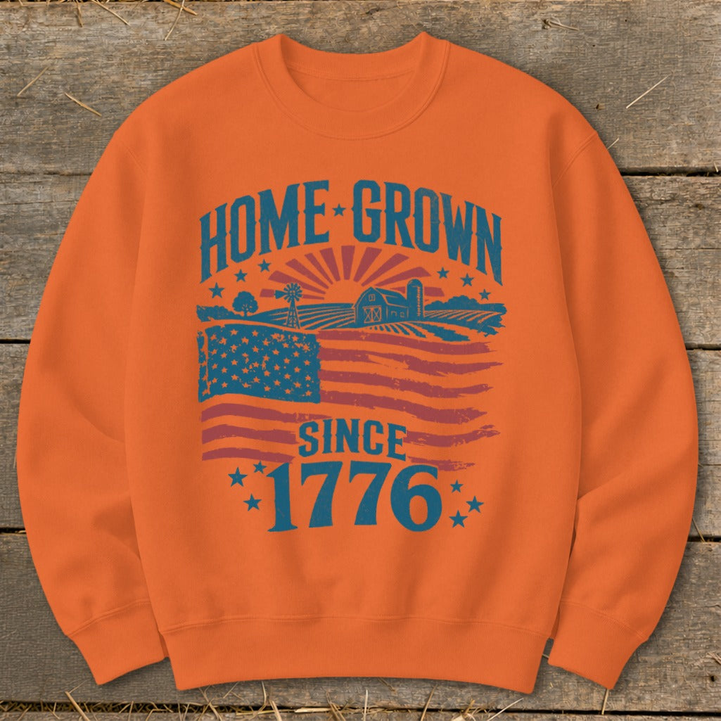 Orange sweatshirt with "HOME GROWN SINCE 1776" text and farm landscape with flag.