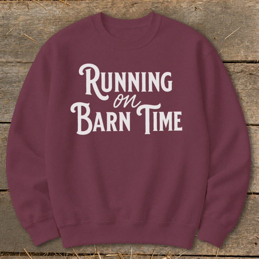 Maroon sweatshirt with white text reading "Running on Barn Time".