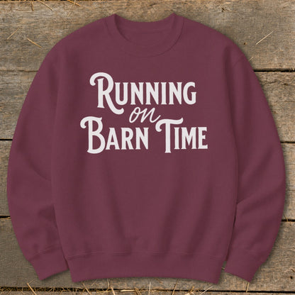 Maroon sweatshirt with white text reading "Running on Barn Time".