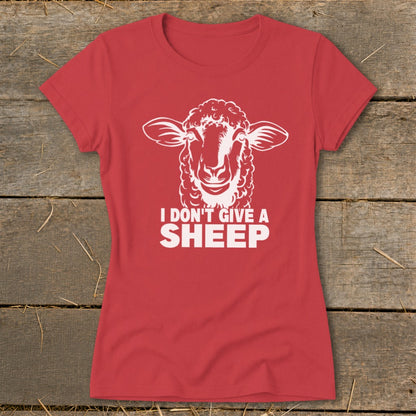 Red t-shirt with white graphic of a sheep and text "I DON'T GIVE A SHEEP".