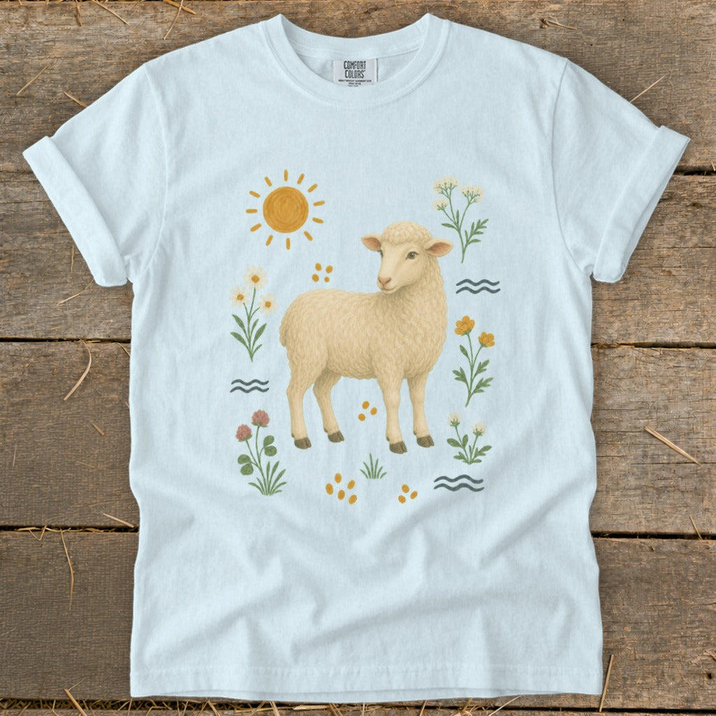 Light blue t-shirt with a fluffy sheep and whimsical nature elements.