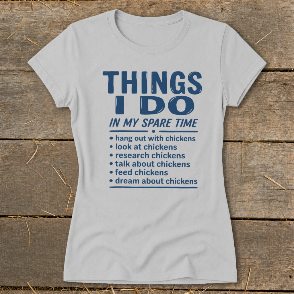 Grey t-shirt with blue text listing chicken-related activities in spare time.