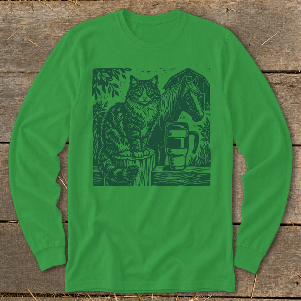 Green long-sleeve shirt featuring a woodcut illustration of a cat, horse, mug, and barn.