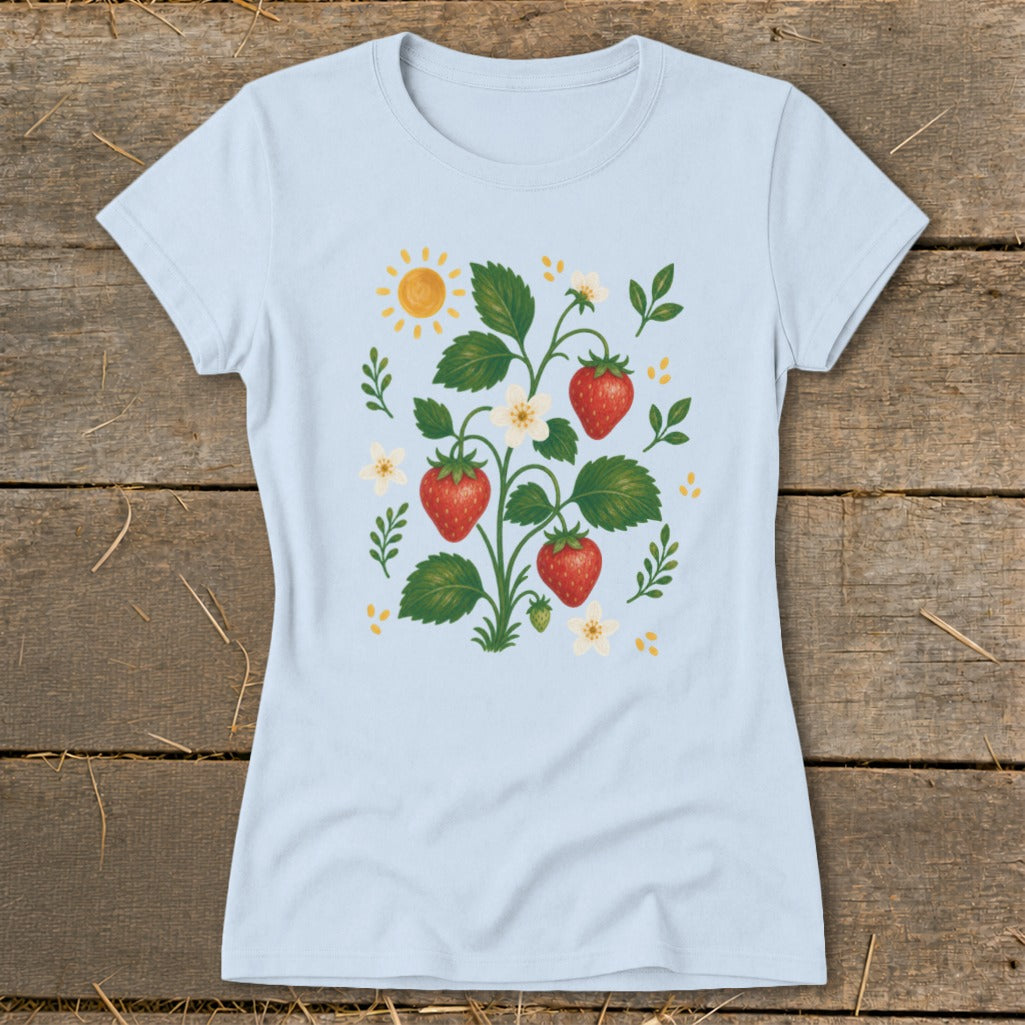 Light blue t-shirt with a strawberry plant illustration featuring sun and flowers.