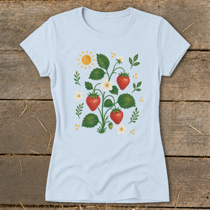 Light blue t-shirt with a strawberry plant illustration featuring sun and flowers.