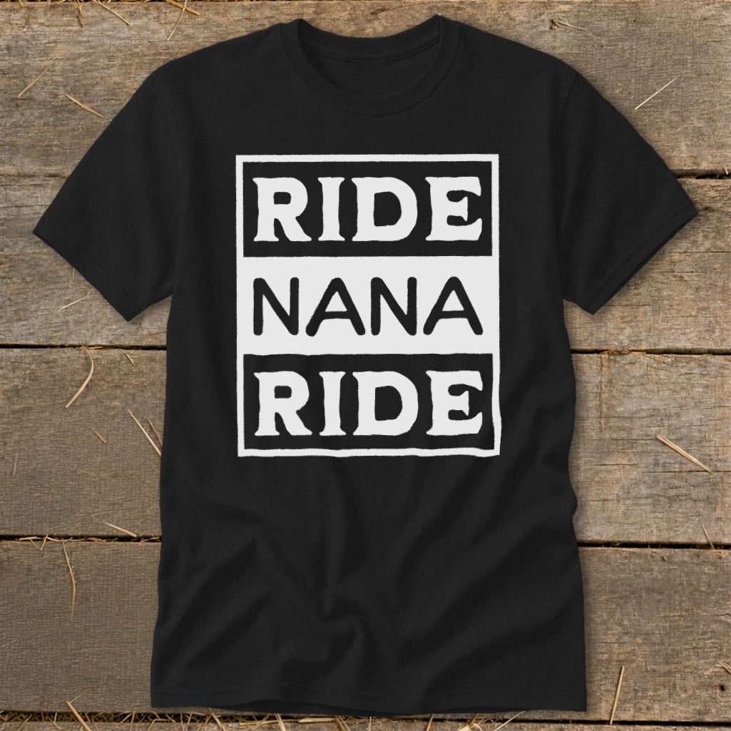 Black t-shirt with white text "RIDE NANA RIDE" in stacked rectangles.