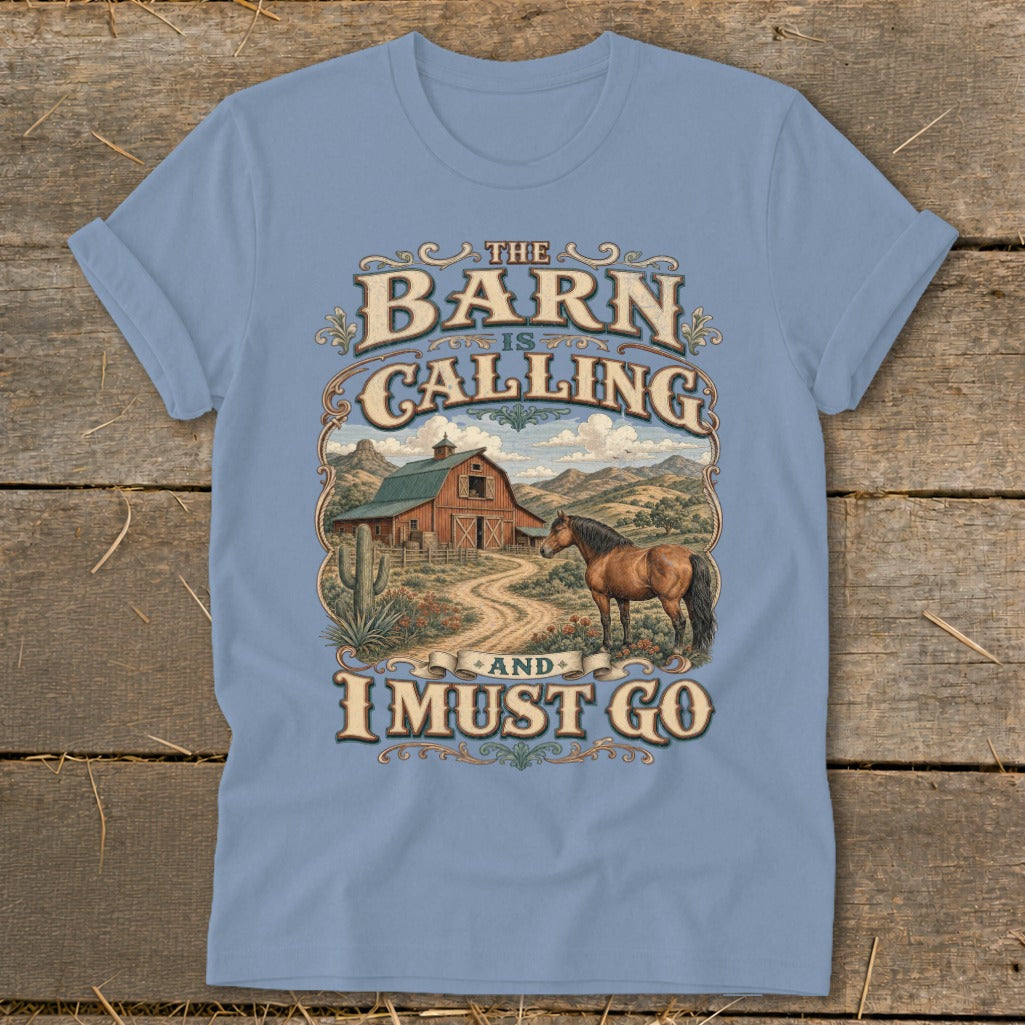 Light blue t-shirt with "The Barn is Calling and I Must Go" graphic and farm scene.