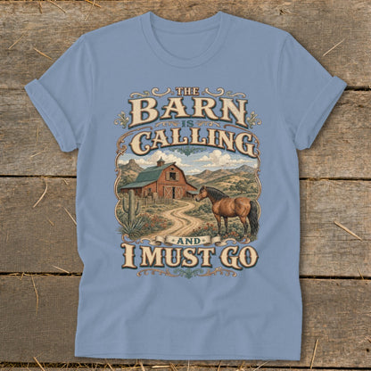 Light blue t-shirt with "The Barn is Calling and I Must Go" graphic and farm scene.