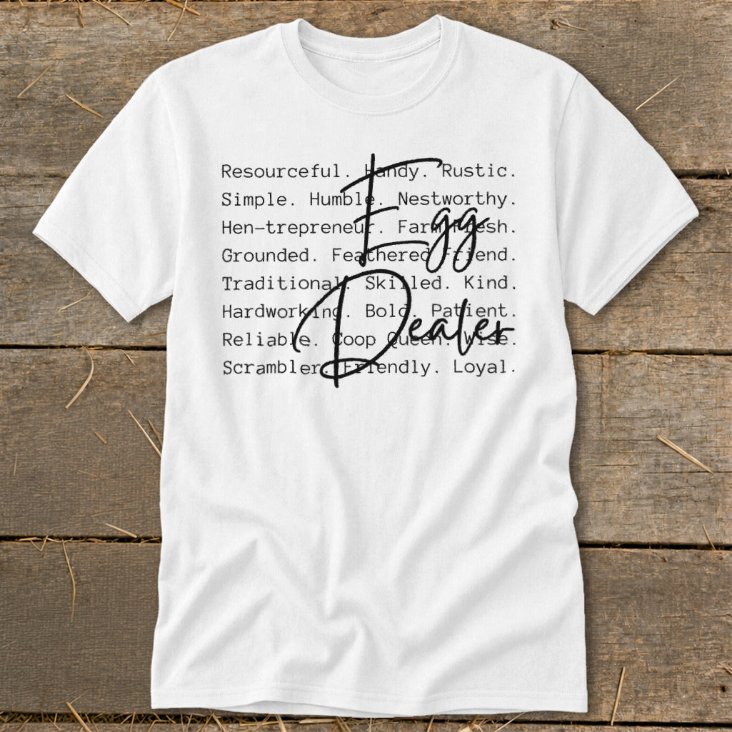 White t-shirt with "Egg Dealer" text listing positive attributes.