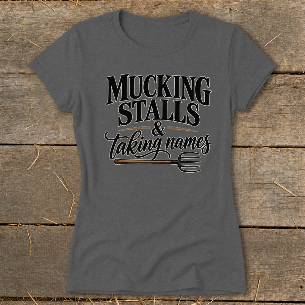 Gray t-shirt with "Mucking Stalls & Taking Names" text and a pitchfork graphic.