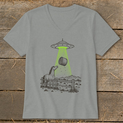UFO beaming up a hay bale with a curious horse watching.