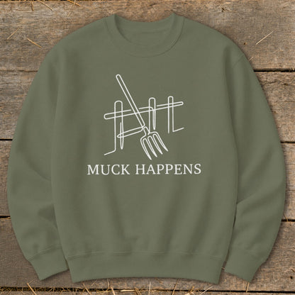 Olive green sweatshirt with white graphic of pitchfork and fence, "MUCK HAPPENS" text.