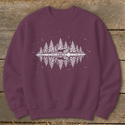 Maroon sweatshirt with white graphic of horse and reflection in winter forest scene.