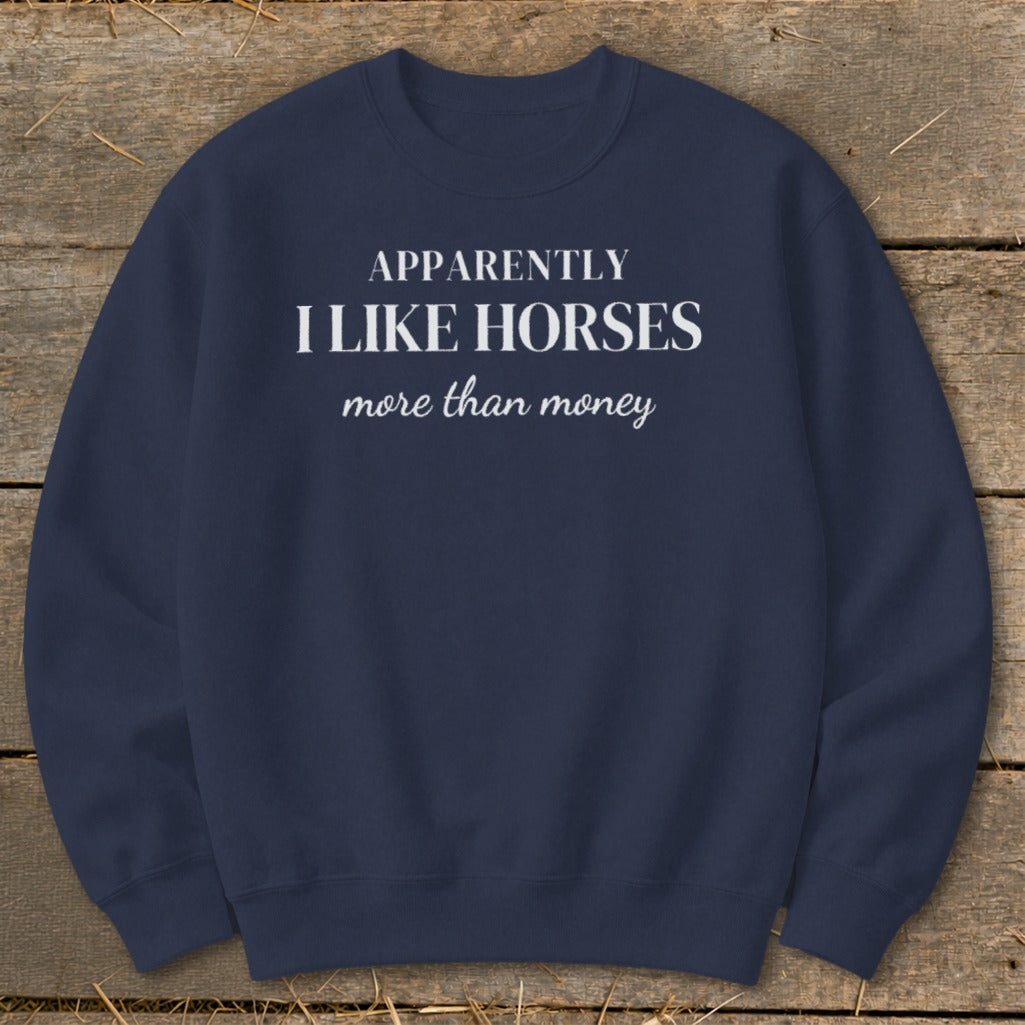 Navy sweatshirt with white text: "Apparently I Like Horses more than money".