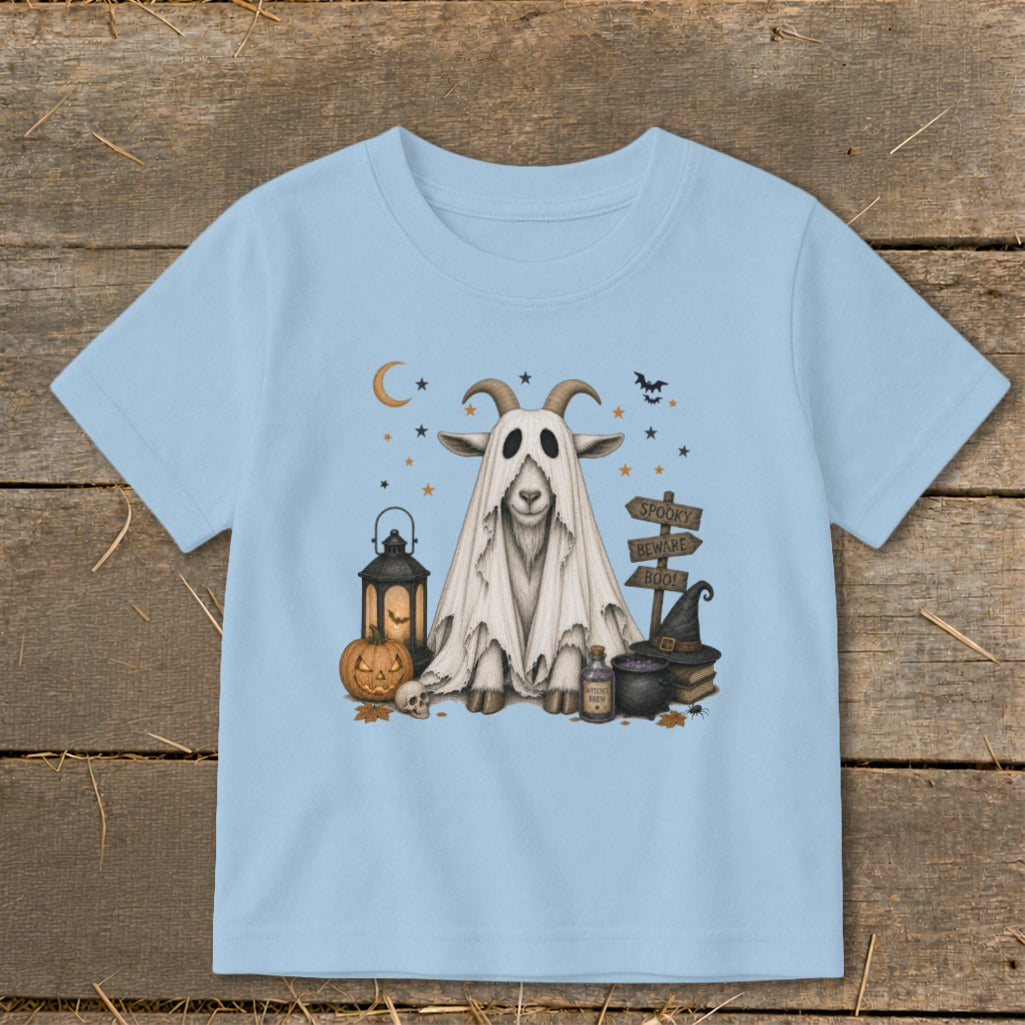 Goat in ghost costume with Halloween decorations and spooky signs.