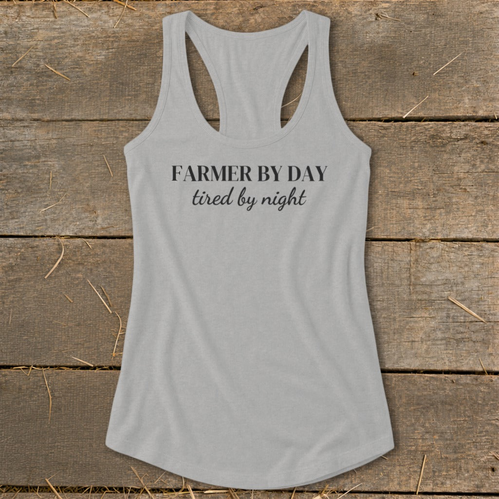 Light grey racerback tank top with "FARMER BY DAY tired by night" text.