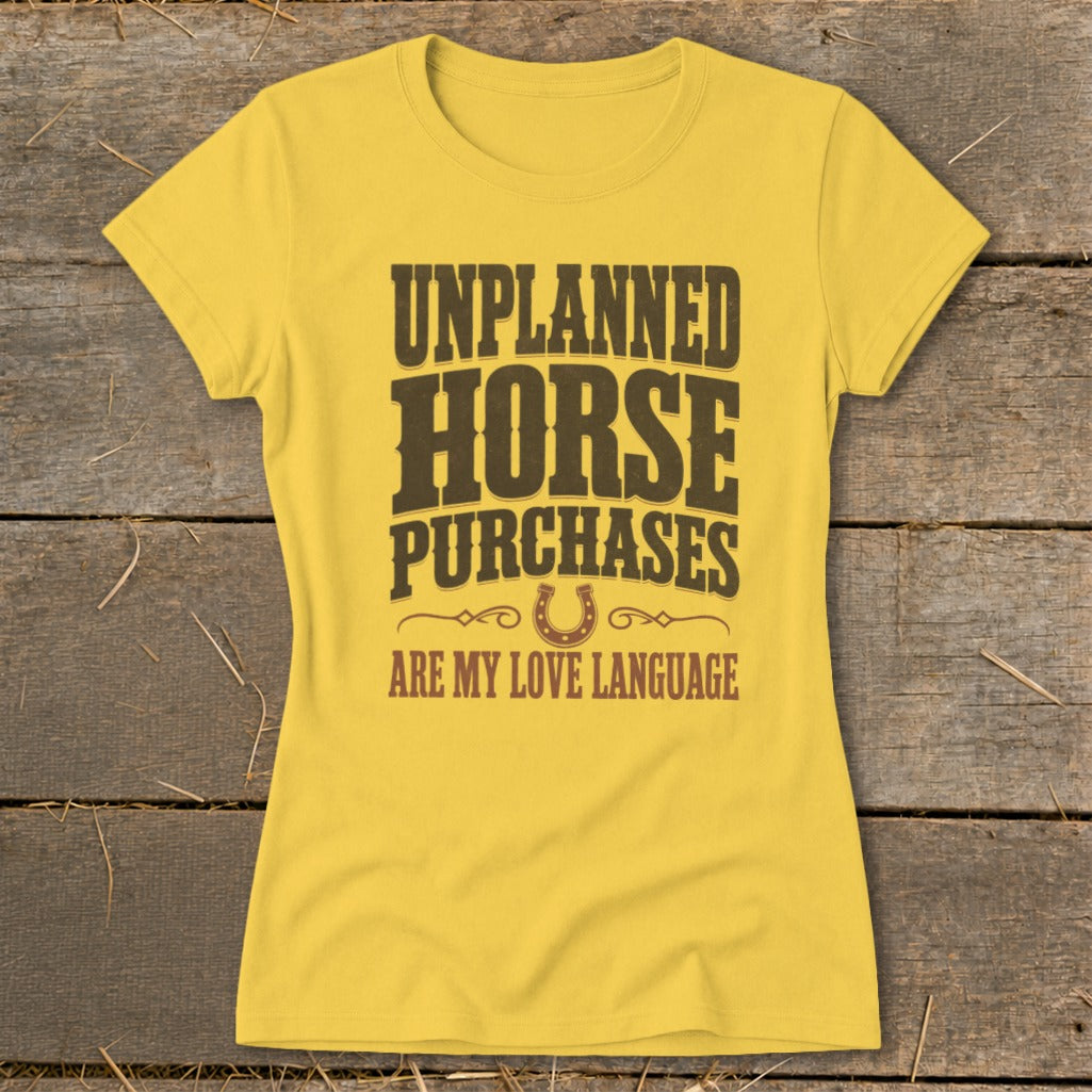 Yellow t-shirt with text "UNPLANNED HORSE PURCHASES ARE MY LOVE LANGUAGE".
