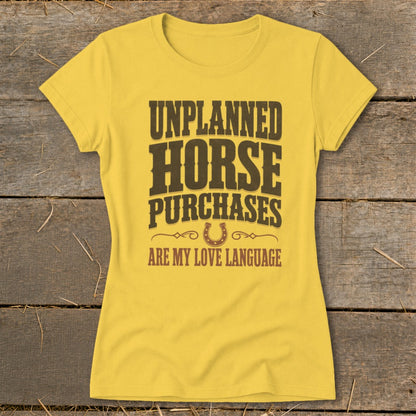 Yellow t-shirt with text "UNPLANNED HORSE PURCHASES ARE MY LOVE LANGUAGE".