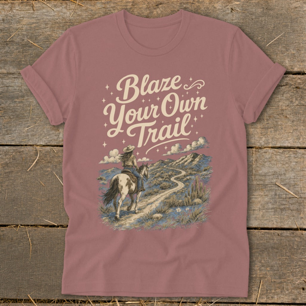 Woman riding horse on desert trail with text "Blaze Your Own Trail."