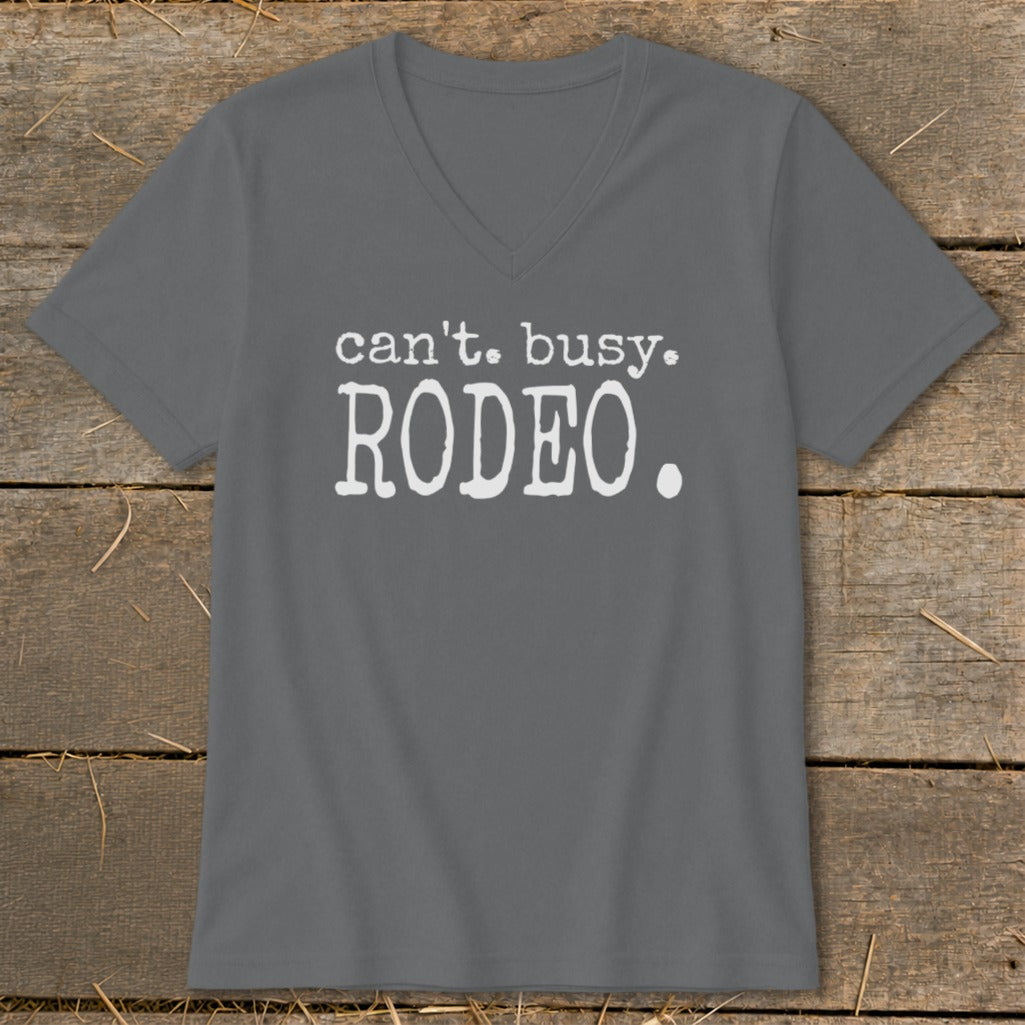 Grey v-neck t-shirt with white text: "can't. busy. RODEO."