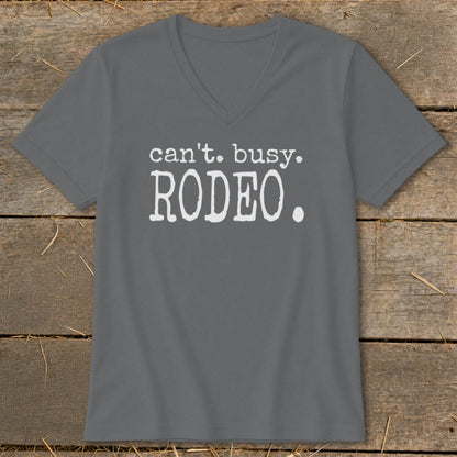 Grey v-neck t-shirt with white text: "can't. busy. RODEO."