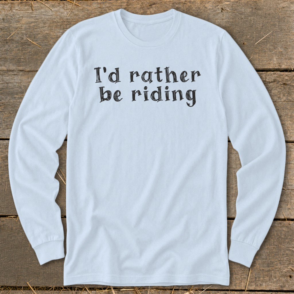 Light blue long sleeve shirt with black text that reads "I'd rather be riding".