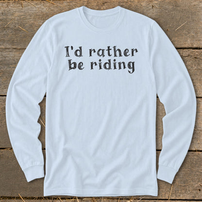 Light blue long sleeve shirt with black text that reads "I'd rather be riding".