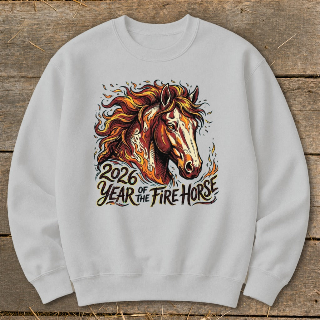 White sweatshirt with graphic of fiery horse and text "2026 Year of the Fire Horse."
