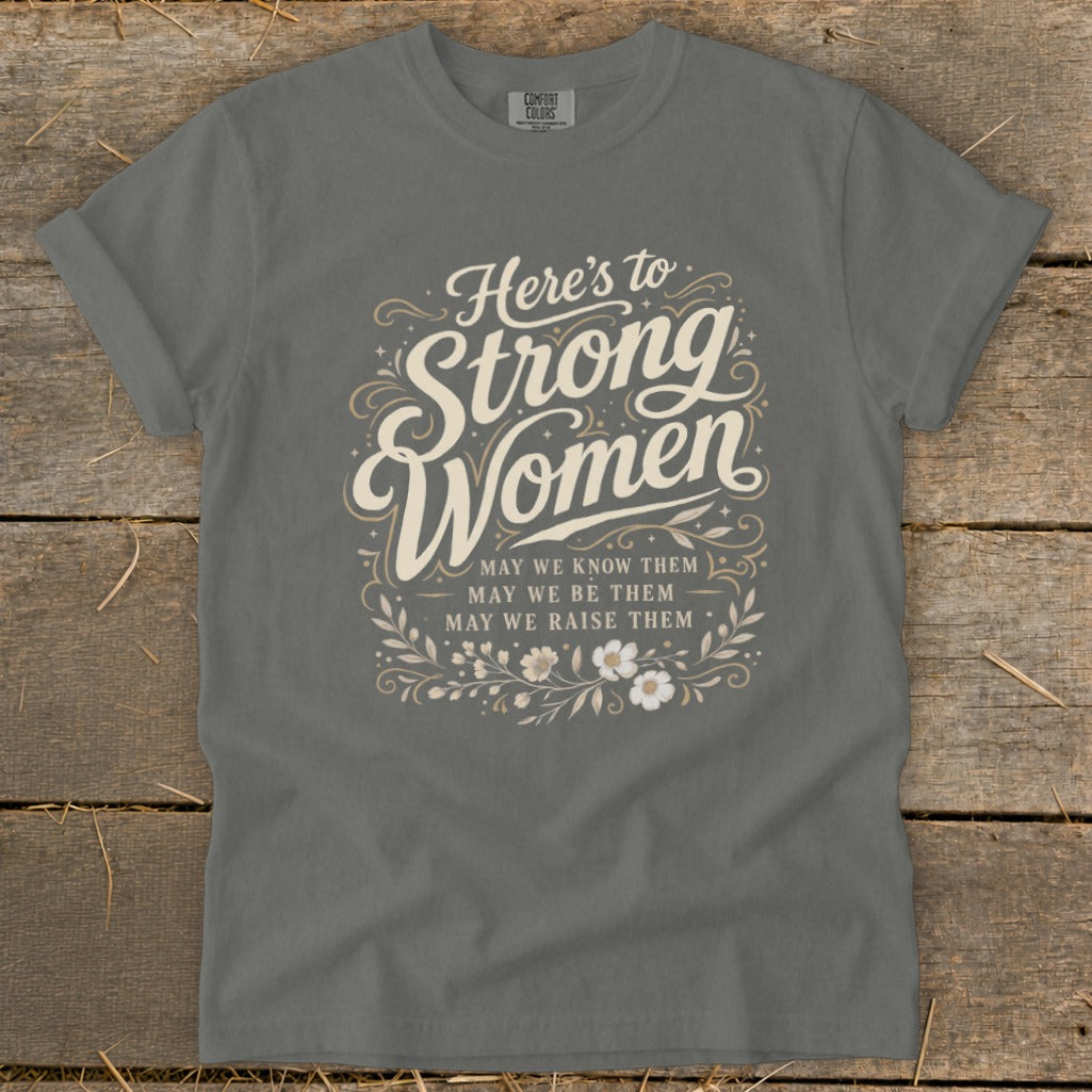 Graphic t-shirt with "Here's to Strong Women" text and floral accents.