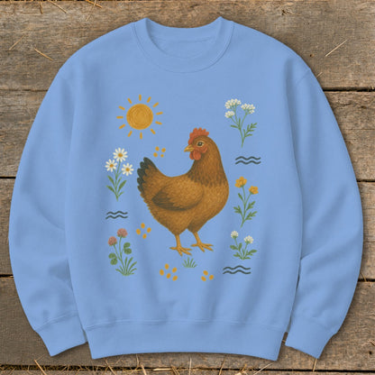 Light blue sweatshirt with a brown hen, sun, flowers, and wavy lines illustration.