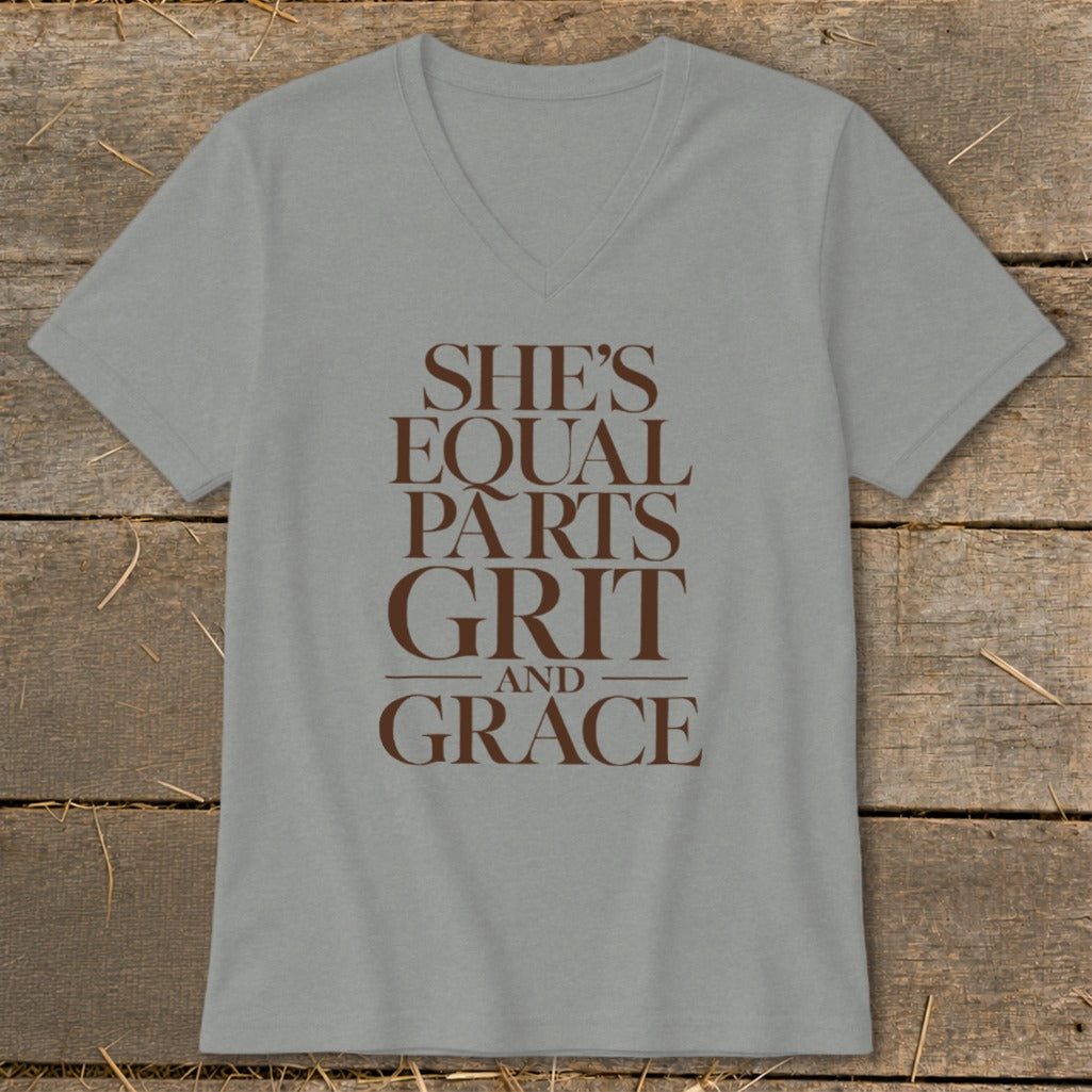 Gray v-neck t-shirt with brown text reading "SHE'S EQUAL PARTS GRIT AND GRACE".